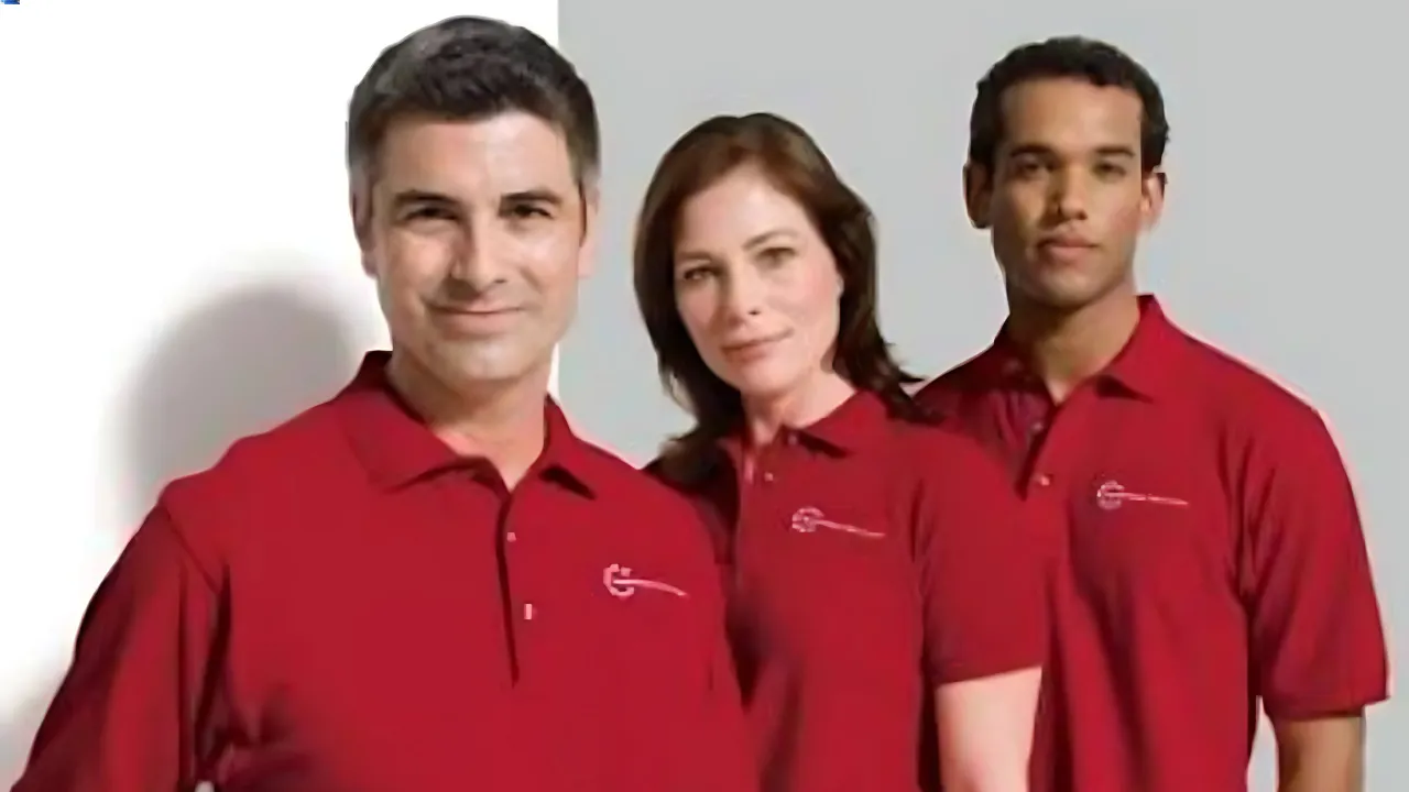 A professional team wearing matching red company shirts, an ideal example of how to design your own polo t shirt.